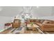 Inviting living room featuring a comfortable brown leather sectional and decorative rug at 813 Bear Lake Dr., Longs, SC 29568