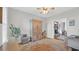 Neutral living room features built-ins, a ceiling fan, and open doorway to a connecting room at 813 Bear Lake Dr., Longs, SC 29568