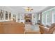 Comfortable living room with a brick fireplace, built-in shelves, and a large sectional sofa at 813 Bear Lake Dr., Longs, SC 29568