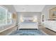 Tranquil main bedroom featuring a large window, white furniture, and a stylish patterned rug at 813 Bear Lake Dr., Longs, SC 29568