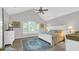 Serene main bedroom with vaulted ceilings, plush carpet, and elegant white furniture at 813 Bear Lake Dr., Longs, SC 29568