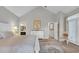 Bright main bedroom with ensuite bath and adjacent sitting area, featuring vaulted ceiling at 813 Bear Lake Dr., Longs, SC 29568