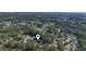 Wide aerial shot of a home surrounded by mature trees in a quiet neighborhood at 88 Purple Martin Dr., Murrells Inlet, SC 29576