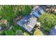 Aerial view of a home with mature trees and manicured landscaping in a quiet neighborhood at 88 Purple Martin Dr., Murrells Inlet, SC 29576