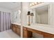 Well-lit bathroom featuring a vanity area, a mirror, and an adjacent shower/tub area at 88 Purple Martin Dr., Murrells Inlet, SC 29576