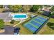 Aerial view of community amenities: a swimming pool, shuffleboard, and pickleball courts at 88 Purple Martin Dr., Murrells Inlet, SC 29576
