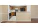 View of kitchen featuring wooden cabinetry and black appliances at 88 Purple Martin Dr., Murrells Inlet, SC 29576
