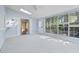 Serene sunroom featuring a ceiling fan, a skylight, and large windows with natural light at 88 Purple Martin Dr., Murrells Inlet, SC 29576