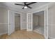 Bright bedroom features wood and carpet flooring, neutral paint, and multiple entry points at 900 Courtyard Dr. # K7, Myrtle Beach, SC 29577