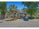 Inviting condo with two-story facade, complemented by well-manicured landscaping and ample parking at 900 Courtyard Dr. # K7, Myrtle Beach, SC 29577