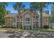 Multi-story condo building with palm trees, landscaping, and dark roof at 900 Courtyard Dr. # K7, Myrtle Beach, SC 29577