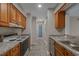 Pass-through kitchen featuring wood cabinets and modern appliances at 900 Courtyard Dr. # K7, Myrtle Beach, SC 29577