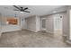 Spacious living room with tiled floor, ceiling fan, and multiple doorways, offering a versatile layout at 900 Courtyard Dr. # K7, Myrtle Beach, SC 29577