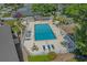 Large community swimming pool with chairs, tables, and landscaping at 900 Courtyard Dr. # K7, Myrtle Beach, SC 29577