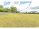 Large backyard enclosed by a wooden fence, offering ample space for outdoor activities and privacy at 908 Hornbeam Ct., Loris, SC 29569