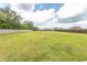 Large backyard enclosed by a wooden fence, offering ample space for outdoor activities and privacy at 908 Hornbeam Ct., Loris, SC 29569