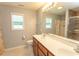 Bathroom with a double vanity, tiled floors, and large mirror at 908 Hornbeam Ct., Loris, SC 29569