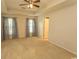 This view of the primary bedroom emphasizes its space and natural light at 908 Hornbeam Ct., Loris, SC 29569