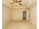 Spacious bedroom featuring a ceiling fan, neutral carpet, and ample natural light at 908 Hornbeam Ct., Loris, SC 29569