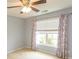 Bedroom featuring a ceiling fan and large window at 908 Hornbeam Ct., Loris, SC 29569