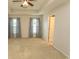 The primary bedroom with a tray ceiling is brightened by large windows at 908 Hornbeam Ct., Loris, SC 29569