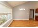 Dining room features a window with natural light, a chandelier and hardwood floors at 908 Hornbeam Ct., Loris, SC 29569