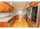 This kitchen provides counter space, stainless appliances, and wood cabinets at 908 Hornbeam Ct., Loris, SC 29569