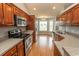 Spacious kitchen features stainless steel appliances, light gray walls, and ample counter space at 908 Hornbeam Ct., Loris, SC 29569
