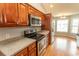 This is a kitchen view featuring stainless steel appliances and wood-tone cabinetry at 908 Hornbeam Ct., Loris, SC 29569