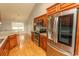 A bright eat-in kitchen showcases stainless steel appliances and wood cabinets at 908 Hornbeam Ct., Loris, SC 29569