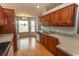 A warm kitchen with wood cabinets, stainless appliances, and a lovely breakfast nook at 908 Hornbeam Ct., Loris, SC 29569