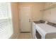 Functional laundry room with machines, shelving, and a window to the outside at 908 Hornbeam Ct., Loris, SC 29569