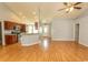Open-concept living area featuring hardwood floors, gray walls, and seamless flow into the kitchen and dining spaces at 908 Hornbeam Ct., Loris, SC 29569