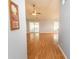 Inviting living room with light-colored walls, wood flooring, a ceiling fan, and sliding door access to the back at 908 Hornbeam Ct., Loris, SC 29569