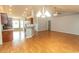 Open-concept living area with hardwood flooring, seamlessly connects to the kitchen and dining spaces at 908 Hornbeam Ct., Loris, SC 29569