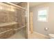 Walk-in shower with glass door and gray tile surround at 908 Hornbeam Ct., Loris, SC 29569