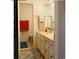 Traditional bathroom featuring a vanity, mirror and neutral tile flooring at 913 Villa Dr. # 913, North Myrtle Beach, SC 29582