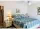 Comfortable bedroom featuring a ceiling fan, lamps and ensuite bathroom access at 913 Villa Dr. # 913, North Myrtle Beach, SC 29582