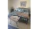 Bedroom with iron bed frame, bench and multiple decorative pillows and throw at 913 Villa Dr. # 913, North Myrtle Beach, SC 29582