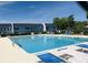 Large community pool with ample seating and lounge chairs, perfect for relaxation and summer fun at 913 Villa Dr. # 913, North Myrtle Beach, SC 29582