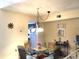 Bright dining area with a glass-top table, seating for four, and warm, inviting decor at 913 Villa Dr. # 913, North Myrtle Beach, SC 29582