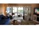 Comfortable living room featuring ample natural light, cozy seating, and access to a sunroom at 913 Villa Dr. # 913, North Myrtle Beach, SC 29582