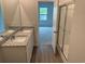 Bathroom featuring double sinks, granite countertops, and glass enclosed shower, offering a spa-like experience at 945 Laconic Dr., Myrtle Beach, SC 29588
