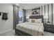 Relaxing bedroom with large bed, stylish nightstands, baseball accents, and plush bedding at 945 Laconic Dr., Myrtle Beach, SC 29588