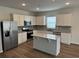 Modern kitchen featuring stainless steel appliances, granite countertops, and a kitchen island with bar seating at 945 Laconic Dr., Myrtle Beach, SC 29588