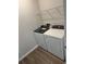 Laundry room with a new washer and dryer, as well as wire shelving for storage at 945 Laconic Dr., Myrtle Beach, SC 29588