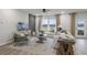 Bright living room with neutral decor, large windows, and comfortable seating at 945 Laconic Dr., Myrtle Beach, SC 29588