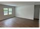 Bright and airy living room with large windows and wood floors, showcasing an inviting space at 945 Laconic Dr., Myrtle Beach, SC 29588