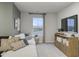 Relaxing living room area with a white sofa, TV, and a window view of the outdoors at 945 Laconic Dr., Myrtle Beach, SC 29588