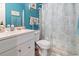 Well-lit bathroom featuring a vanity, a toilet, and a shower-tub with coordinating decor at 9550 Dunes Gable Dr. # A, Myrtle Beach, SC 29572